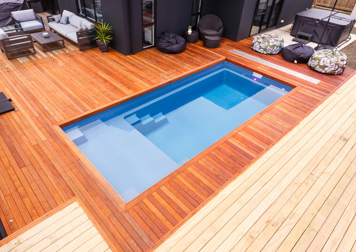 Backyard pool with stained wood